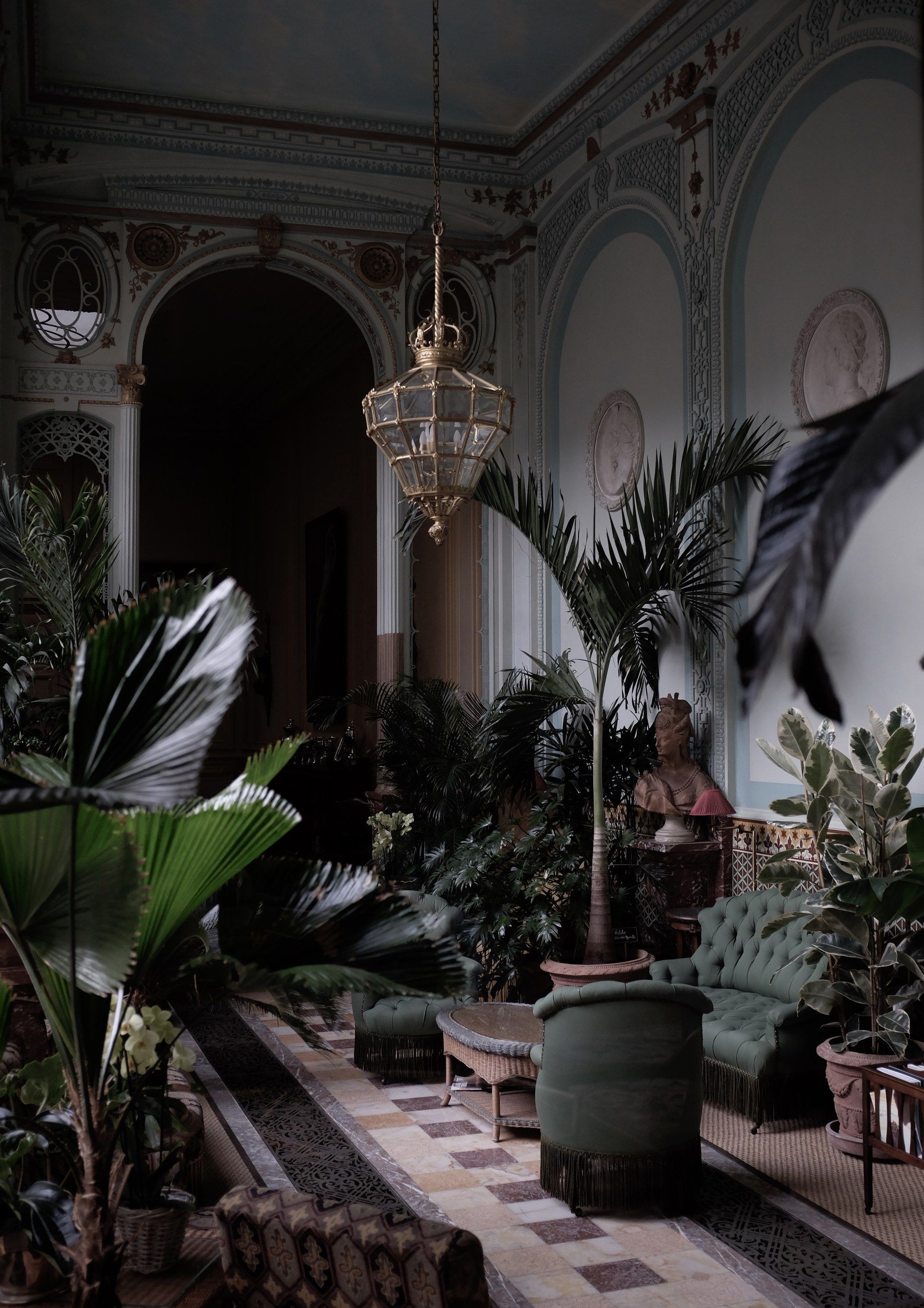 A winter garden with palms and a chandelier
