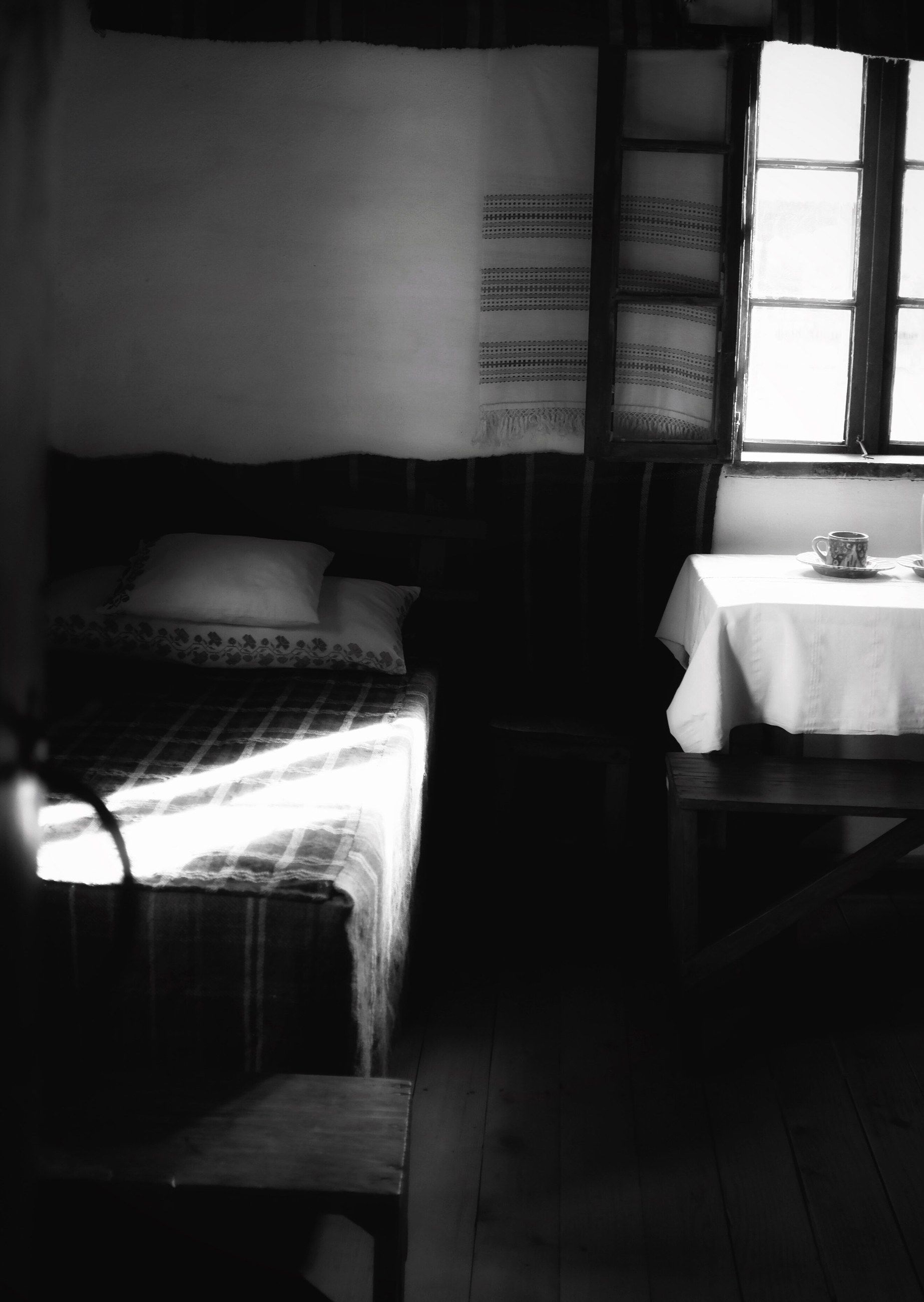 A rustic room with a table by a bright window